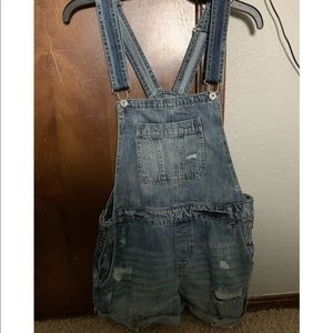 Ripped blue wash overalls
